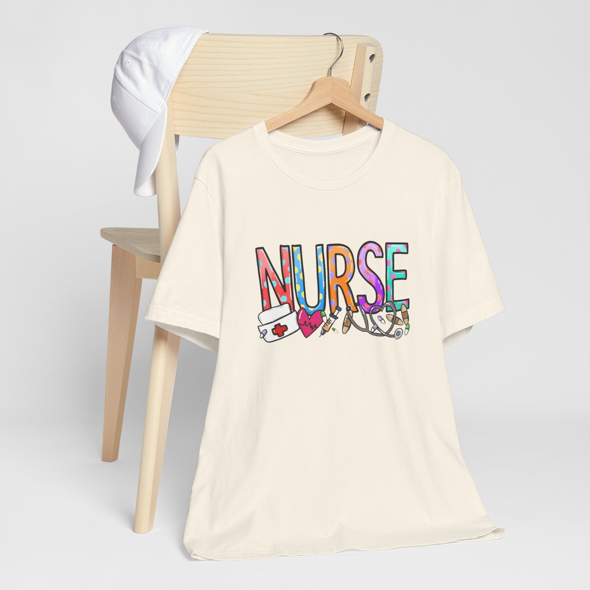 Nurse Floral & Medical Icon Tee - Colorful 'NURSE' Graphic T-Shirt for Healthcare Heroes